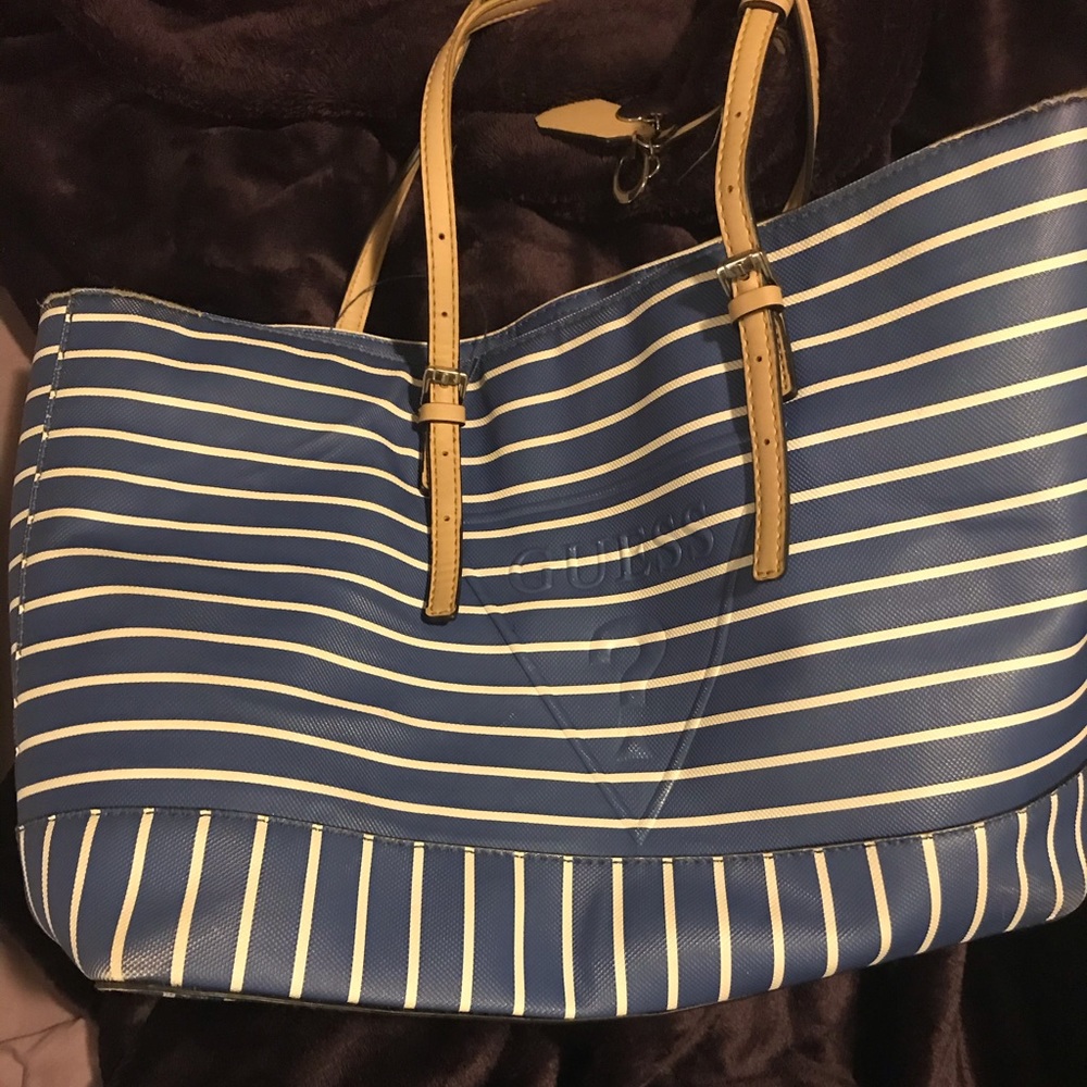 Blue and white striped guess purse with tan straps